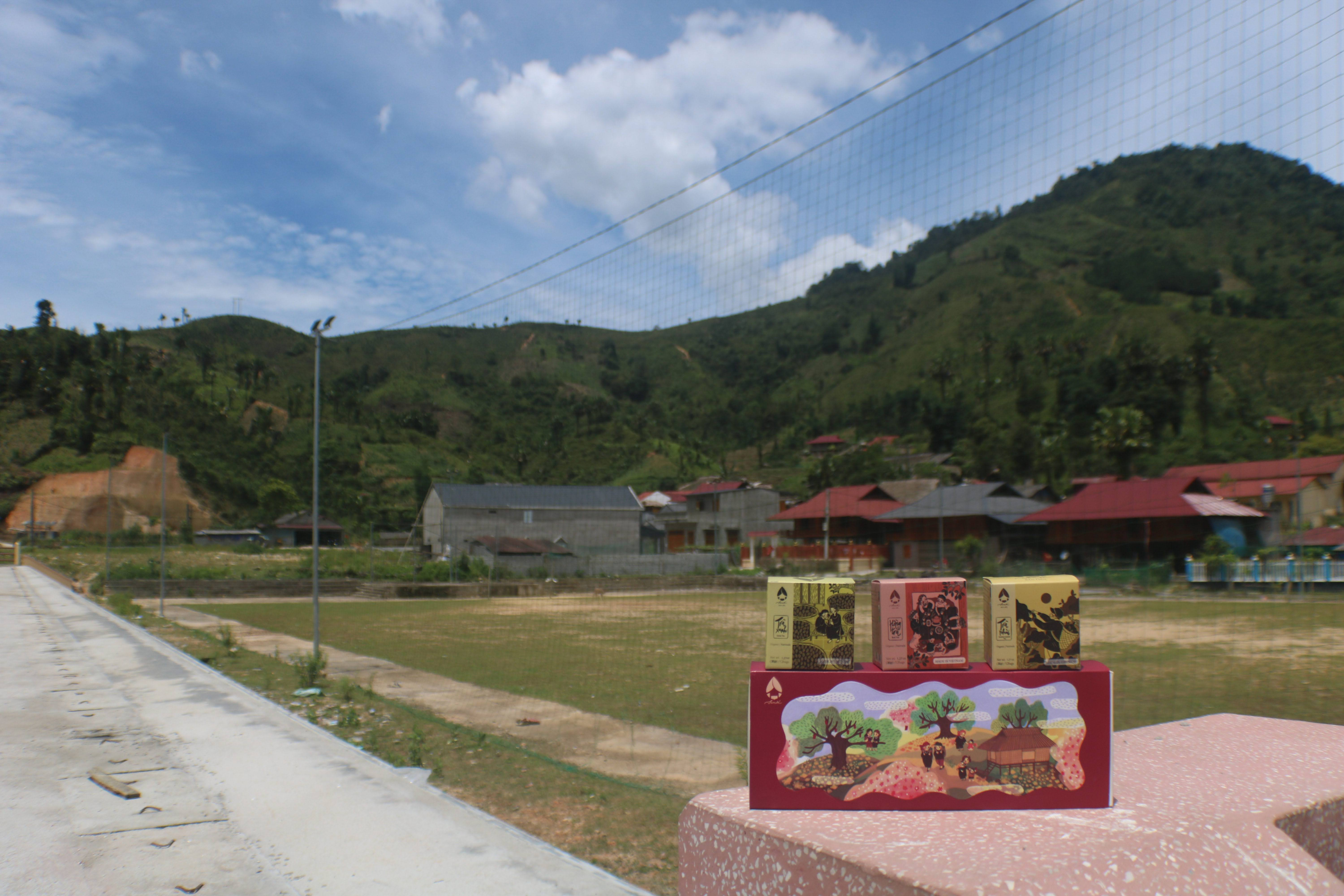 A village at the foot of green hills