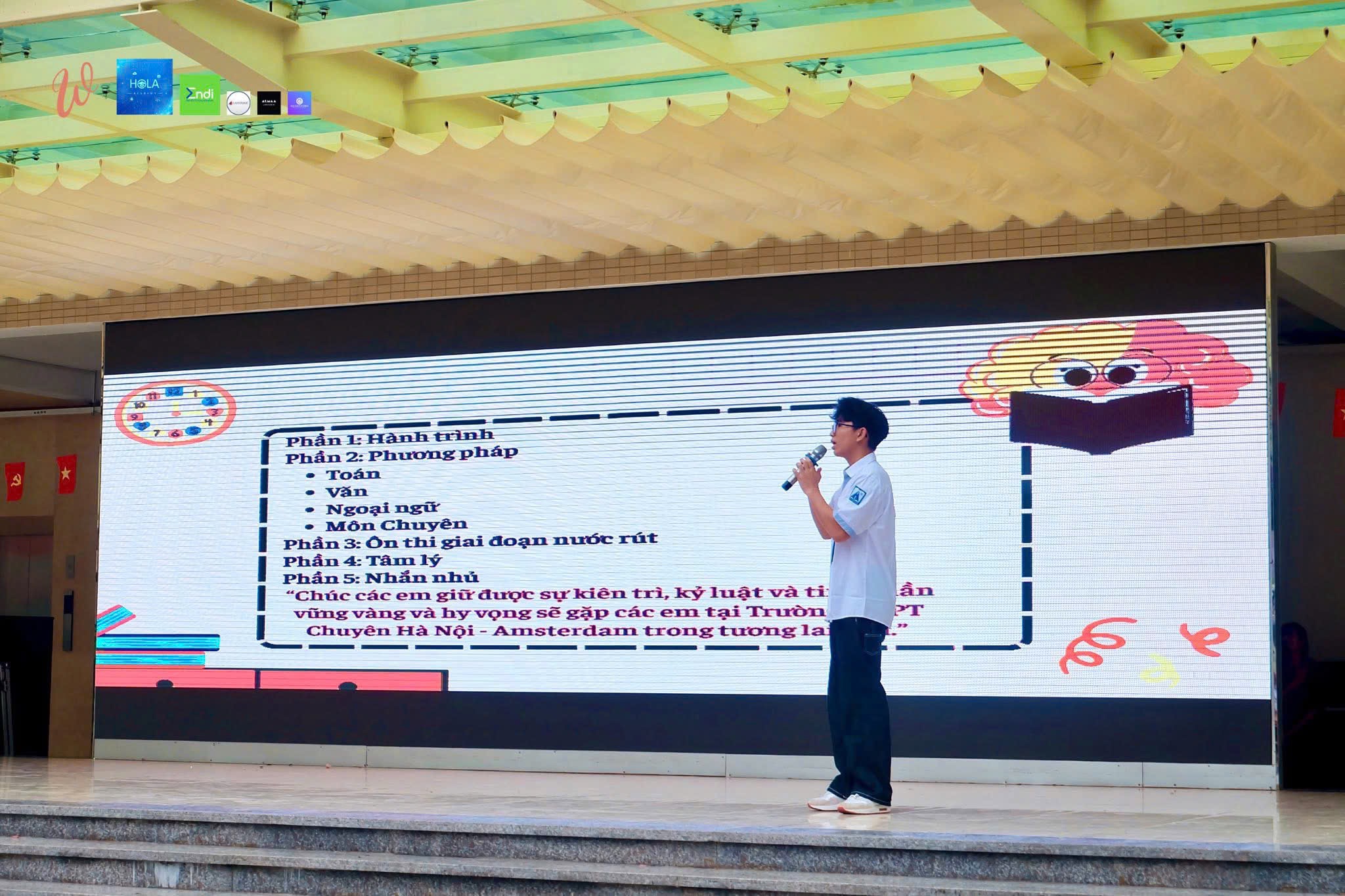 A WITH Project presentation on a school stage