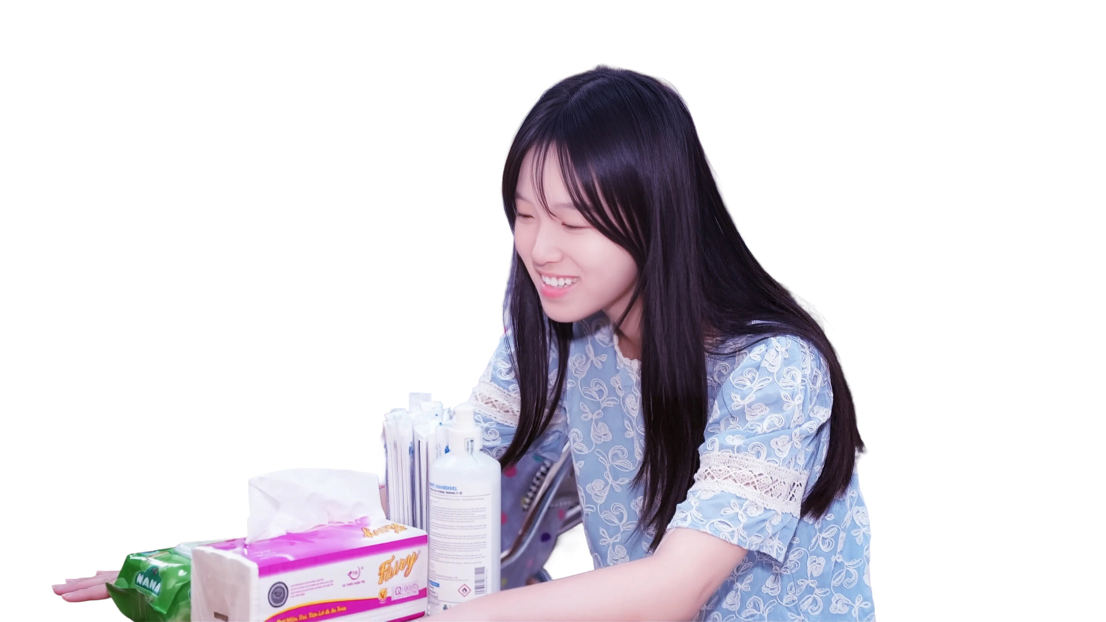 Gia Han smiling while packing gifts